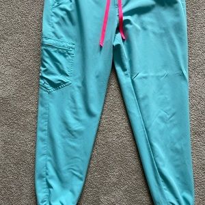 Figs brand scrubs. Top is a medium and bottoms are a large.selling as a set